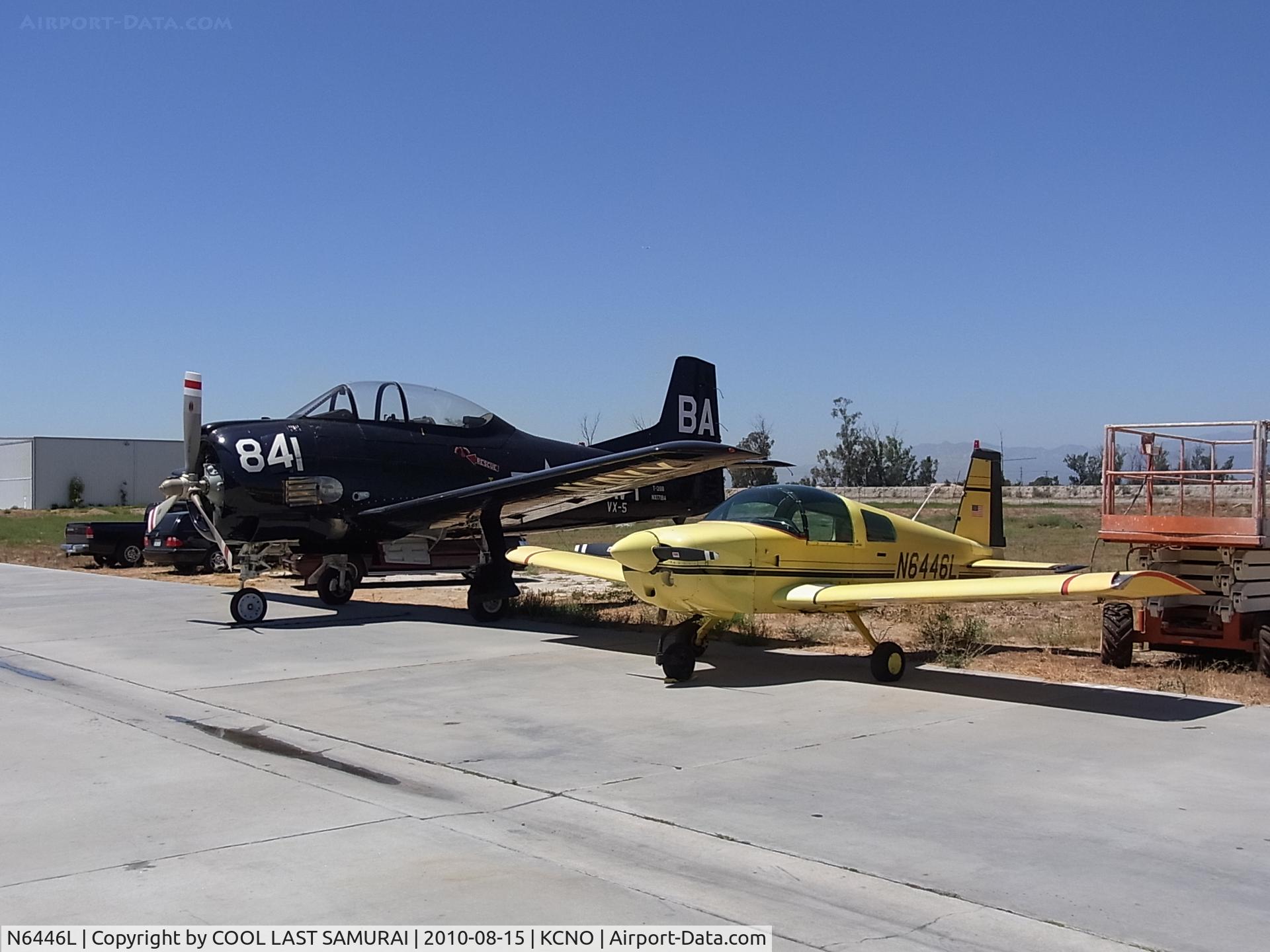 N6446L, 1972 American Aviation AA-1A Trainer C/N AA1A-0446, Grumman AA1A, N6446L, parked next to a T-28 Trojan.
