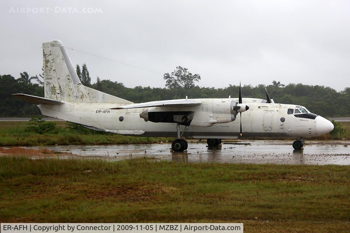 ER-AFH, 1976 Antonov An-26B C/N 3901, The weather was as bad as the state of this aircraft. According to my guide in Belize this plane was used in a drugs-related flight, abandoned by the drugsdealers and since then parked next to the runway for display.