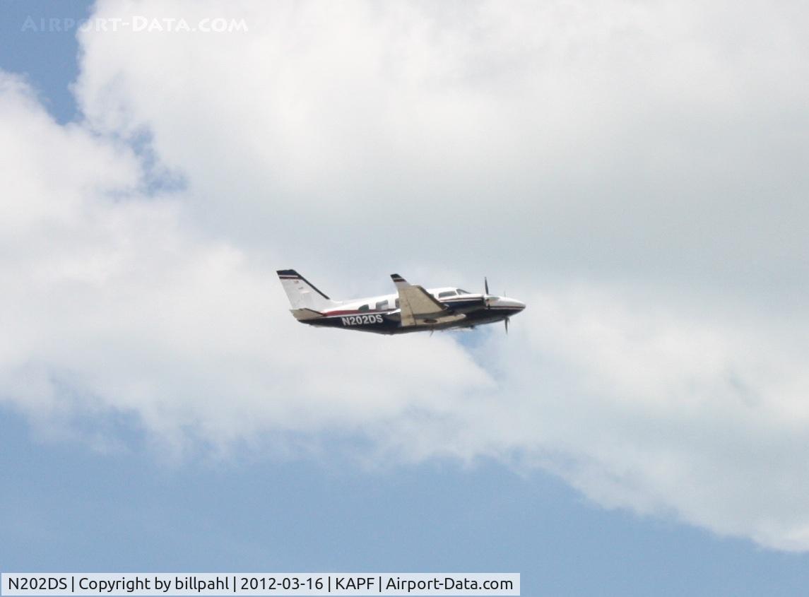 N202DS, 1978 Piper PA-31-325 Navajo C/R C/N 31-7912025, Shortly after takeoff from Naples Municipal