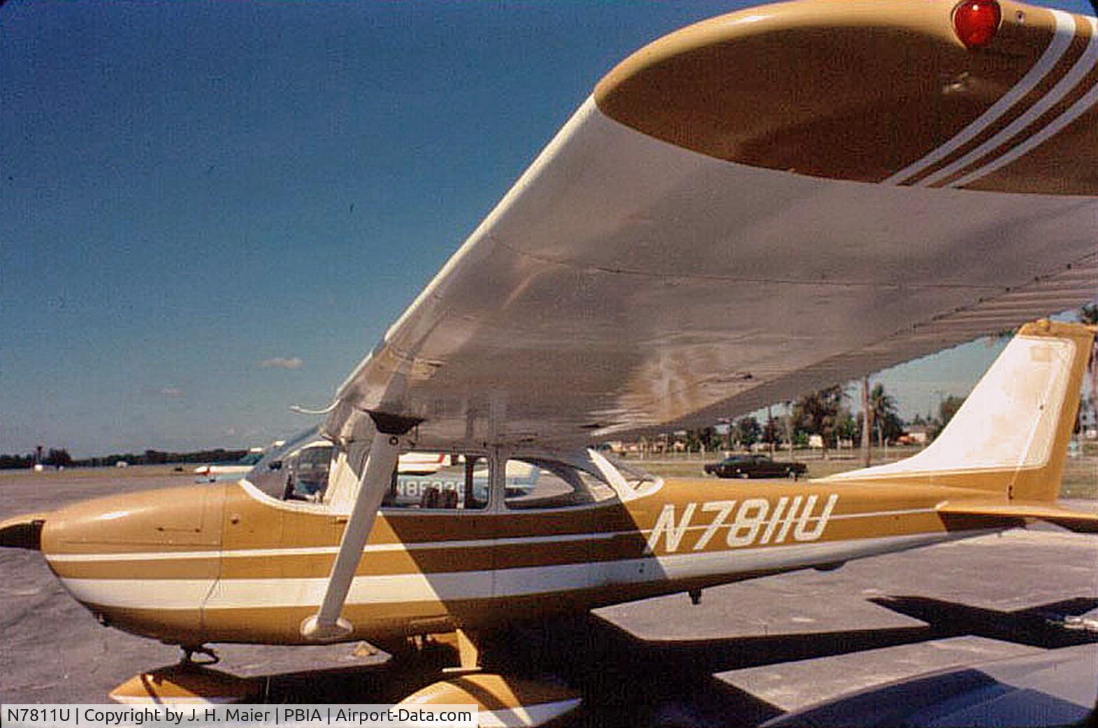 N7811U, 1964 Cessna 172E C/N 17251811, Butler Aviation ramp PBIA c.a. 1975