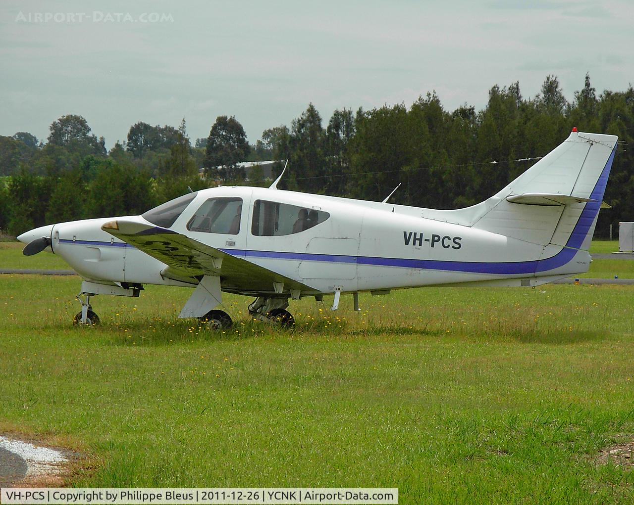 VH-PCS, 1975 Rockwell International 112 Commander C/N 255, Parked in the grass, on a slow and quiet sunny day.