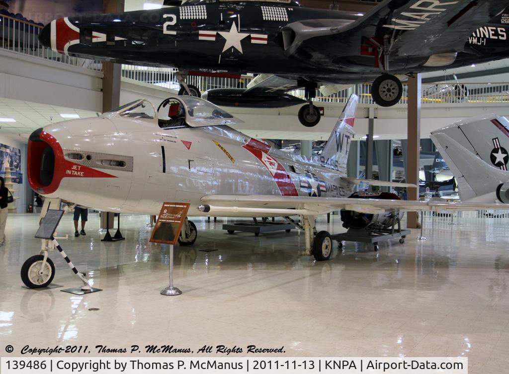 139486, 1957 North American FJ-4 Fury C/N 209-106, A/C, BuNo: 139486, CN:  209-106,  has been restored displaying the markings of the USMC VMF-232 (