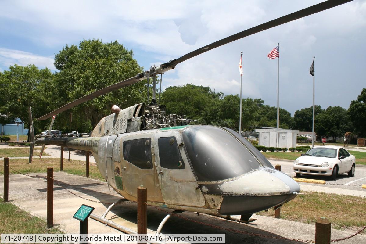 71-20748, 1971 Bell OH-58A Kiowa C/N 41609, OH-58 in veterans Park in Tampa, with a daily Florida thunderstorm forming in background