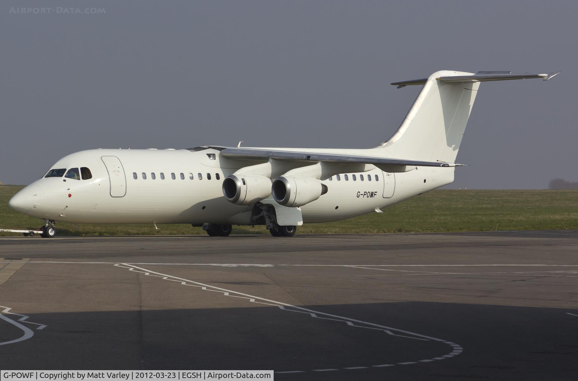 G-POWF, 2000 British Aerospace Avro 146-RJ100 C/N E3373, Being towed to the noth side for engine runs.