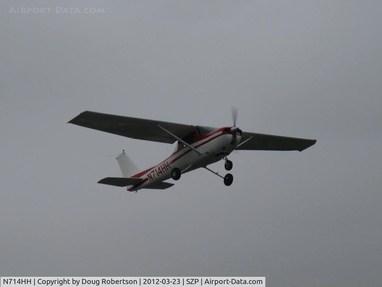 N714HH, 1977 Cessna 150M C/N 15079185, 1977 Cessna 150M, Continental O-200 100 Hp, takeoff climb Rwy 22, murky skies