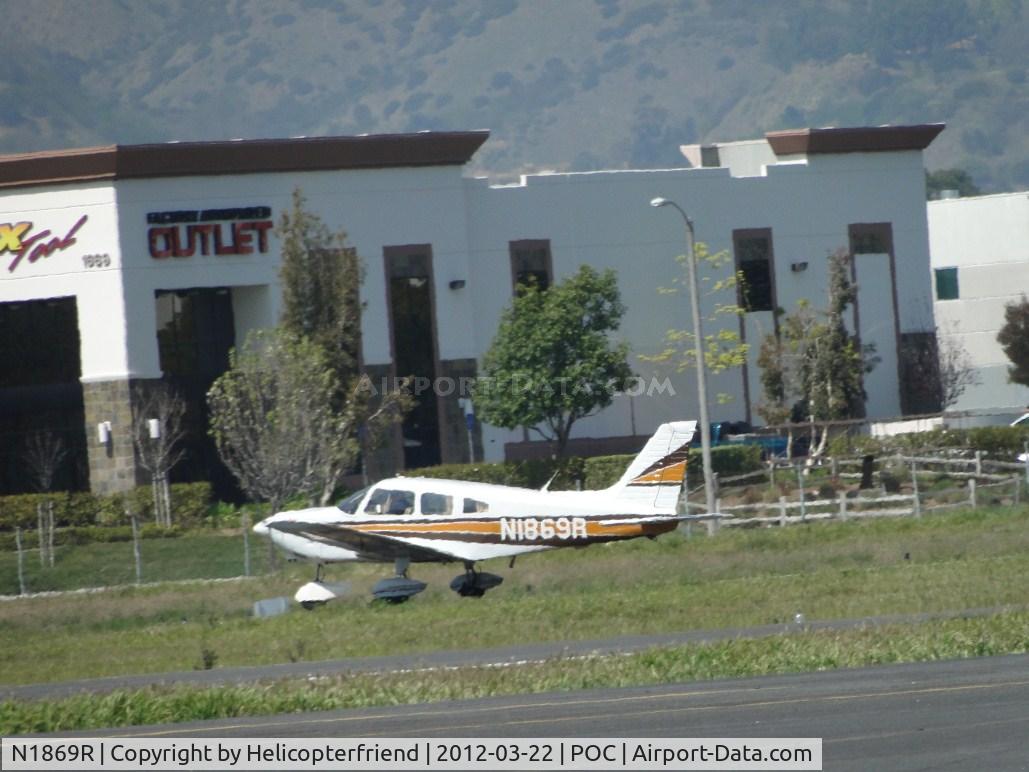 N1869R, 1975 Piper PA-28-181 C/N 28-7690060, Crossed runway 26L and cleared for take off on 26R