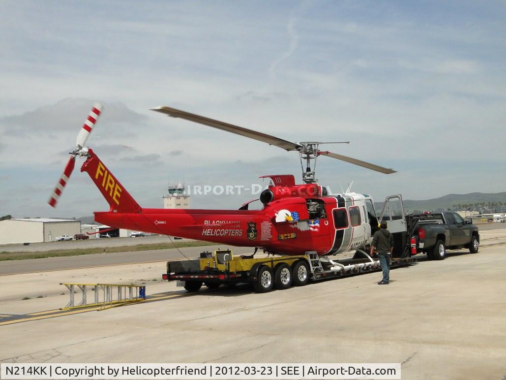 N214KK, 1964 Bell UH-1H Iroquois C/N 4267 (64-13560), Working on the ship while tied down on it's trailer\helipad