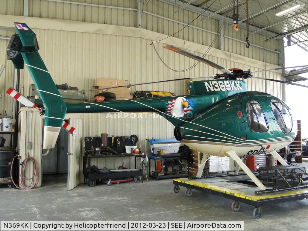 N369KK, 1977 Hughes 369D C/N 470125D, Parked in the hanger on her dolly waiting to be taken out