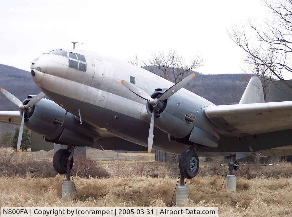N800FA, 1944 Curtiss C-46F Commando C/N 22595, At the entrance of the Glenn H. Curtiss Museum. This C-46 is on loan from the NASM and is mounted on concrete pedestals...the museum staff informed me that the museum had to apply for special permission to display this a/c on this site.