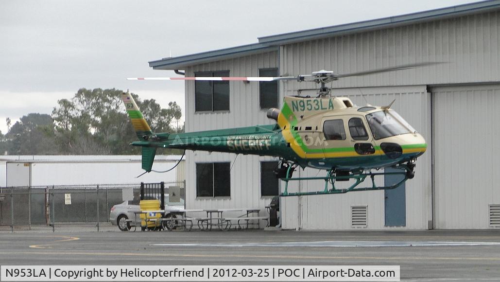 N953LA, Eurocopter AS-350B-2 Ecureuil Ecureuil C/N 4990, Lifting off of pad 5, air taxiing to taxiway Sierra and then eastbound on patrol in the rain