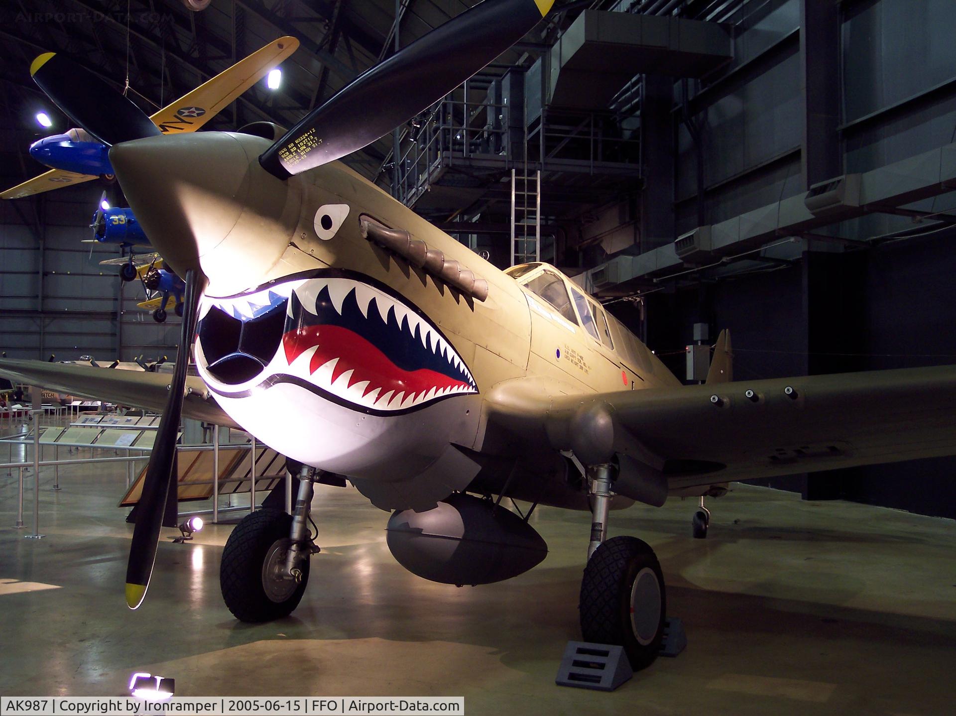 AK987, 1942 Curtiss P-40E Kittyhawk 1A C/N 18731, This is aircraft is painted to represent the P-40E flown in combat by Bruce Holloway, a pilot in both the Flying Tigers and its successor AAF unit, the 23d Fighter Group.  The aircraft is actually a “Kittyhawk” an export version of this Curtiss fighter.