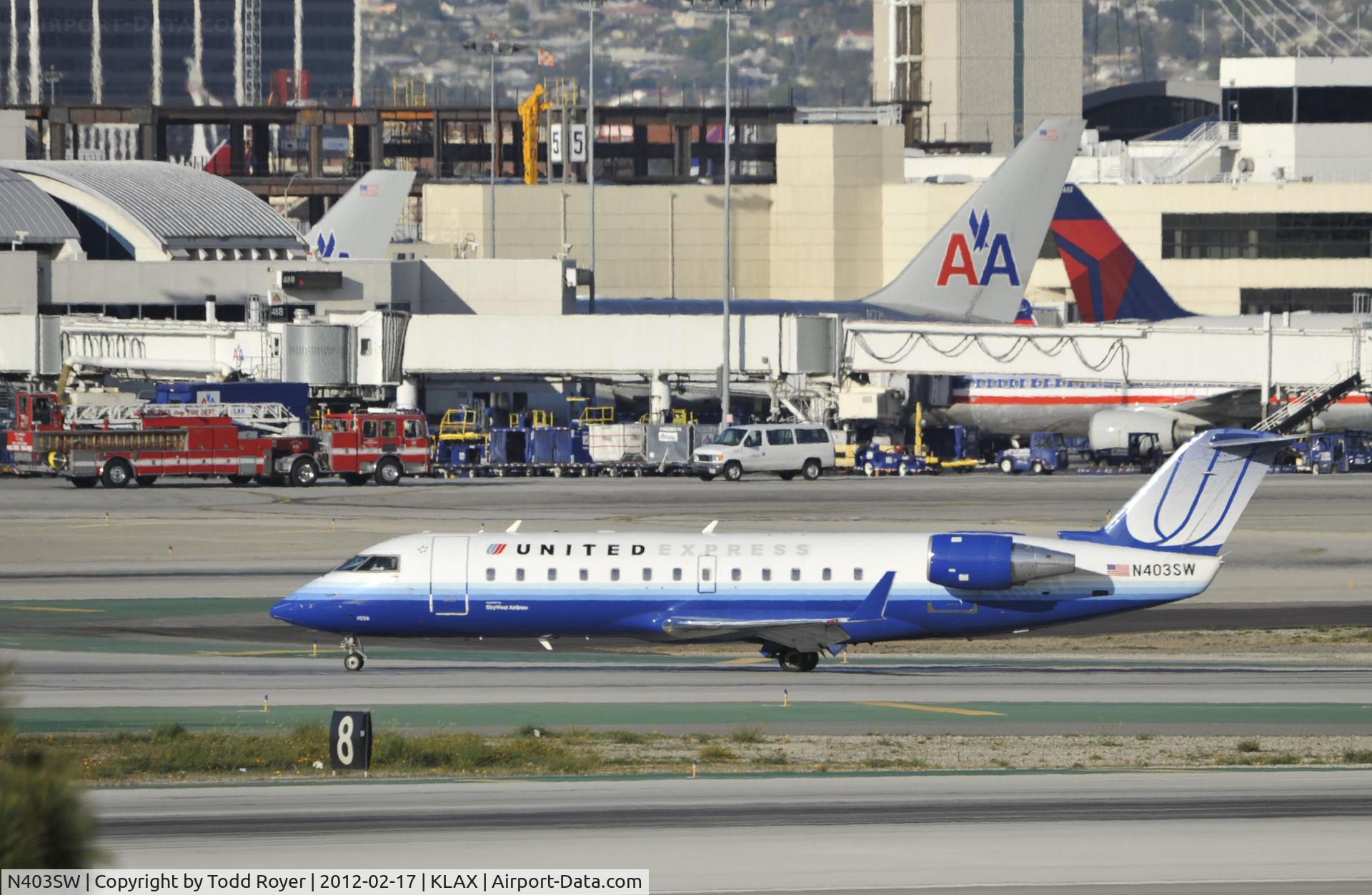 N403SW, 1993 Canadair CRJ-100LR (CL-600-2B19) C/N 7028, Taxiing to gate at LAX