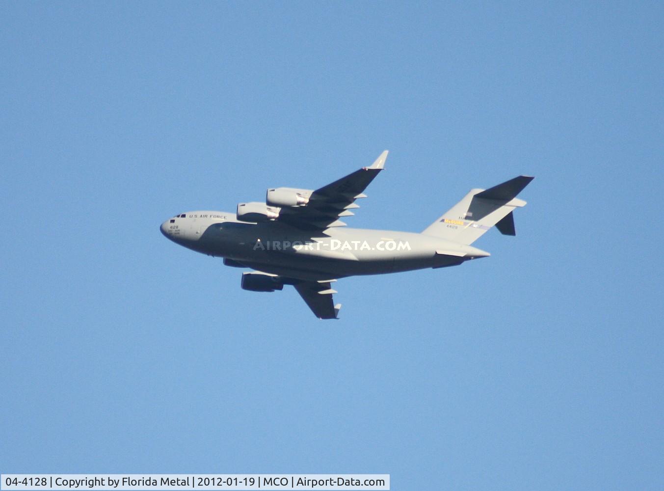 04-4128, 2004 Boeing C-17A Globemaster III C/N P-128, Taken by Executive Airport, C-17 leaving MCO with President Obama's limos