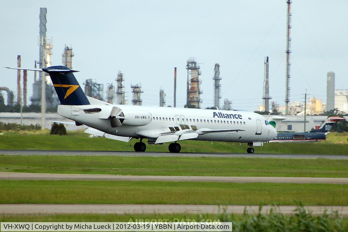 VH-XWQ, 1990 Fokker 100 (F-28-0100) C/N 11300, 2 F100s of Germania and US Airways in the background