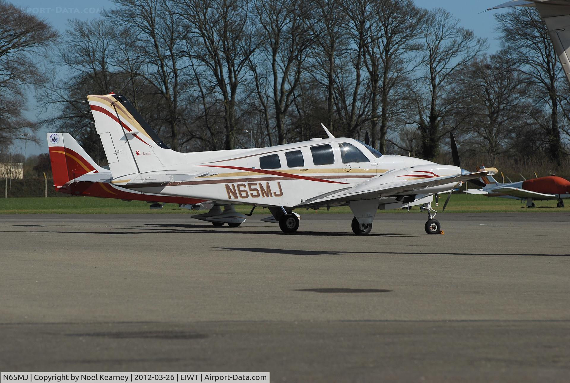 N65MJ, 1985 Beech 58P Baron C/N TJ-487, Seen parked on the apron at Weston.