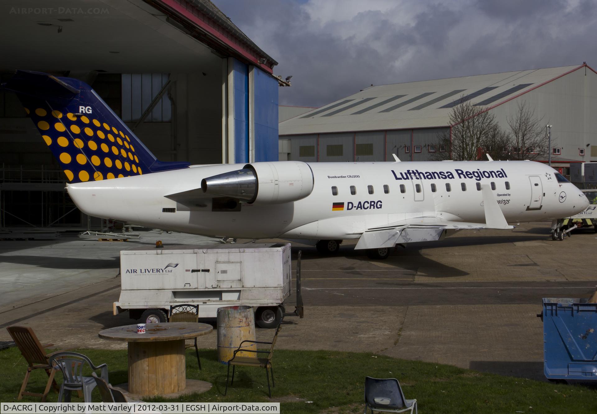 D-ACRG, 2002 Bombardier CRJ-200ER (CL-600-2B19) C/N 7630, Being pushed into the Air Livery hangar for spray into Yamal C/S.