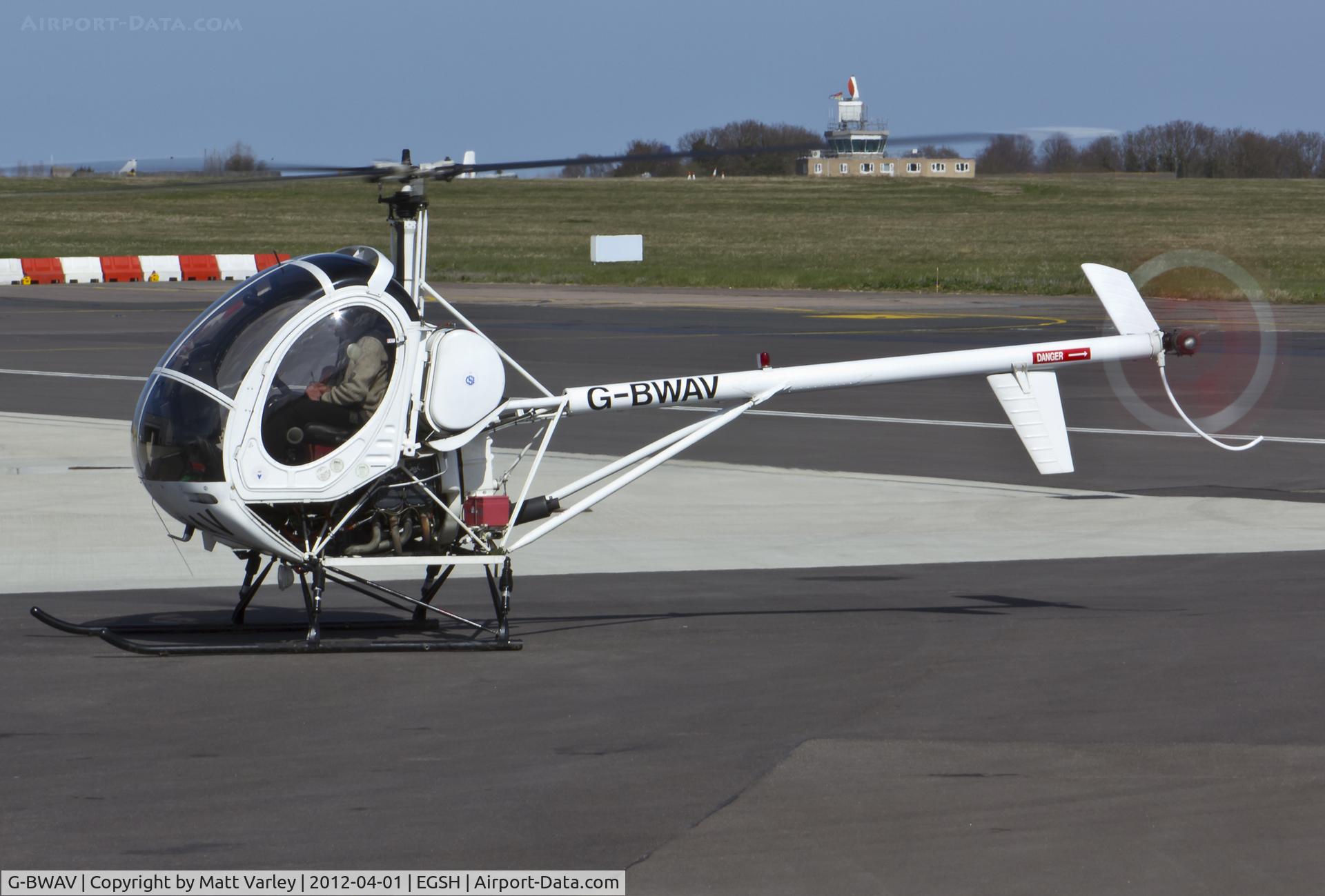 G-BWAV, 1985 Schweizer 269C C/N S-1204, Sat on stand at SaxonAir.