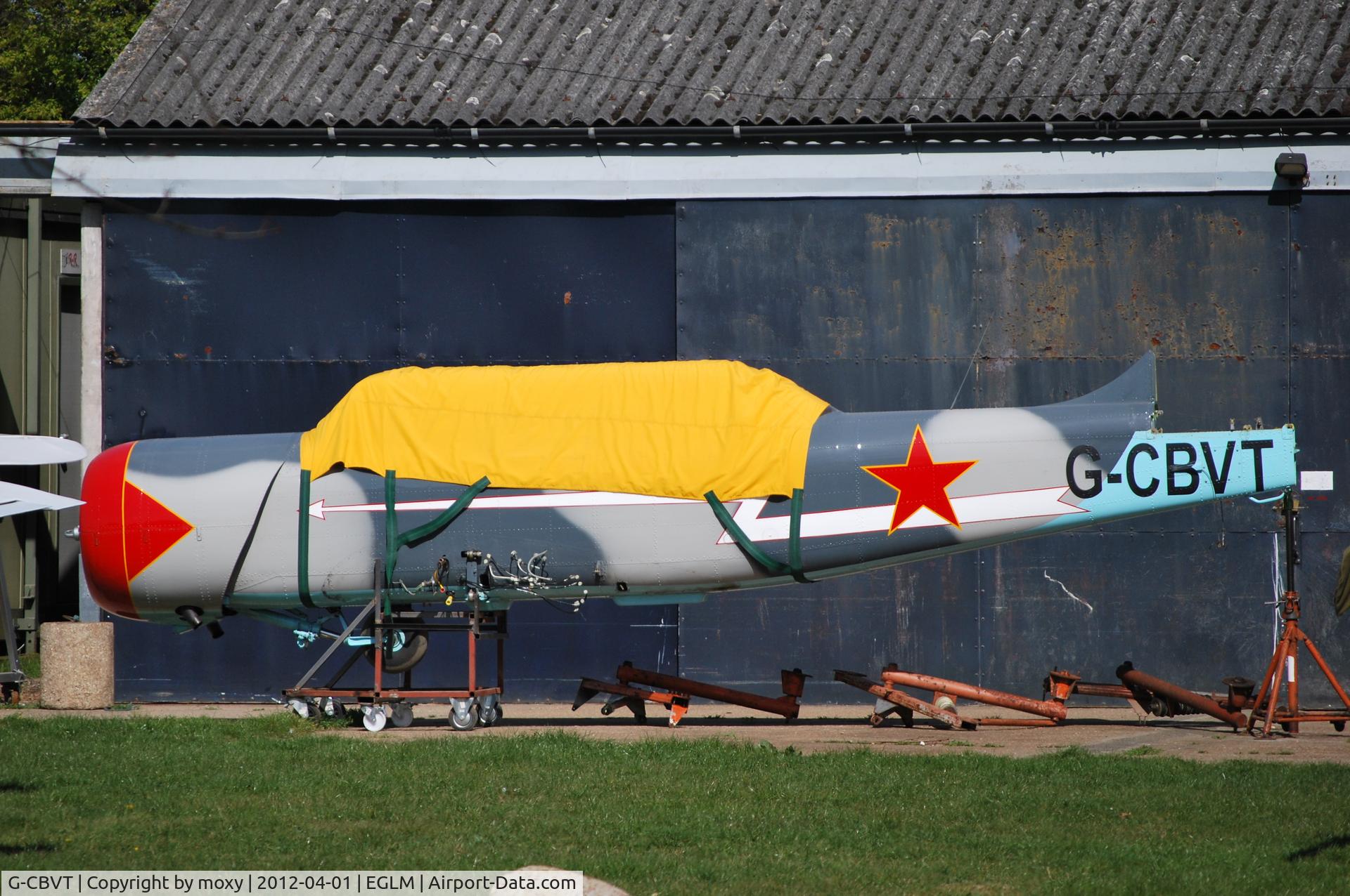 G-CBVT, 1989 Bacau Yak-52 C/N 9010305, Bacau YAK-52 fuselage on stands at White Waltham