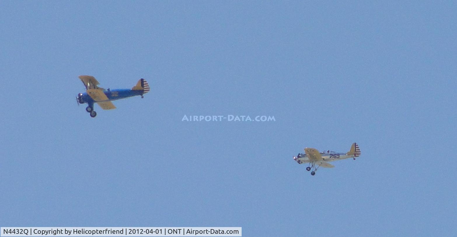 N4432Q, Boeing PT-17 Kaydet (A75N1) C/N 75-1969, Leading N48742 1941 Ryan ST3KR south bound crossing active runways