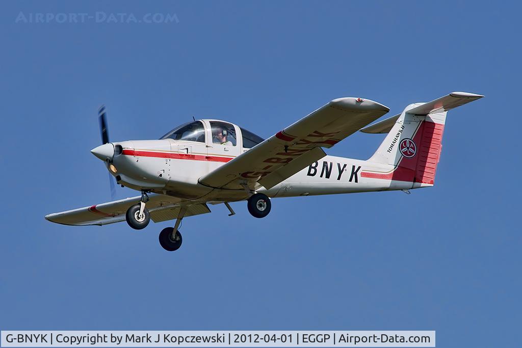 G-BNYK, 1978 Piper PA-38-112 Tomahawk Tomahawk C/N 38-78A0059, On approach to runway 27.  Owner is Lomac Aviators Ltd (note tailplane LAL logo).