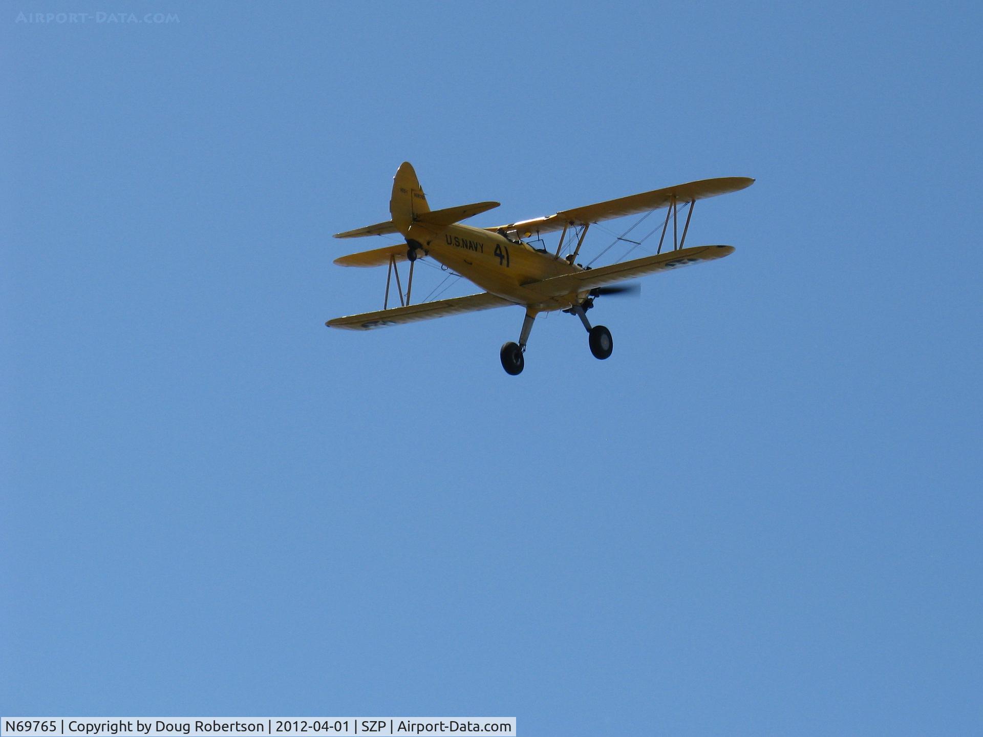 N69765, 1941 Boeing A75N1 (PT17) C/N 75-1044, 1941 Boeing Stearman A75N1 as Navy N2S1, Continental W670-5 220 Hp, climbout Rwy 22