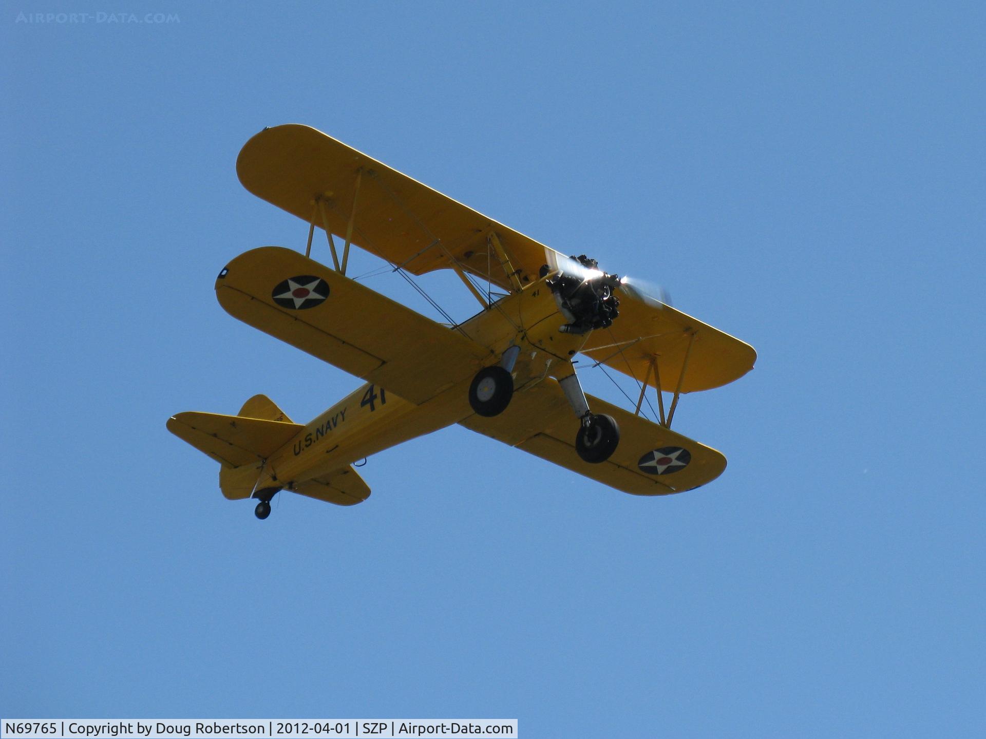 N69765, 1941 Boeing A75N1 (PT17) C/N 75-1044, 1941 Boeing Stearman A75N1 as Navy N2S1, Continental W670-5 220 Hp, takeoff climb Rwy 22
