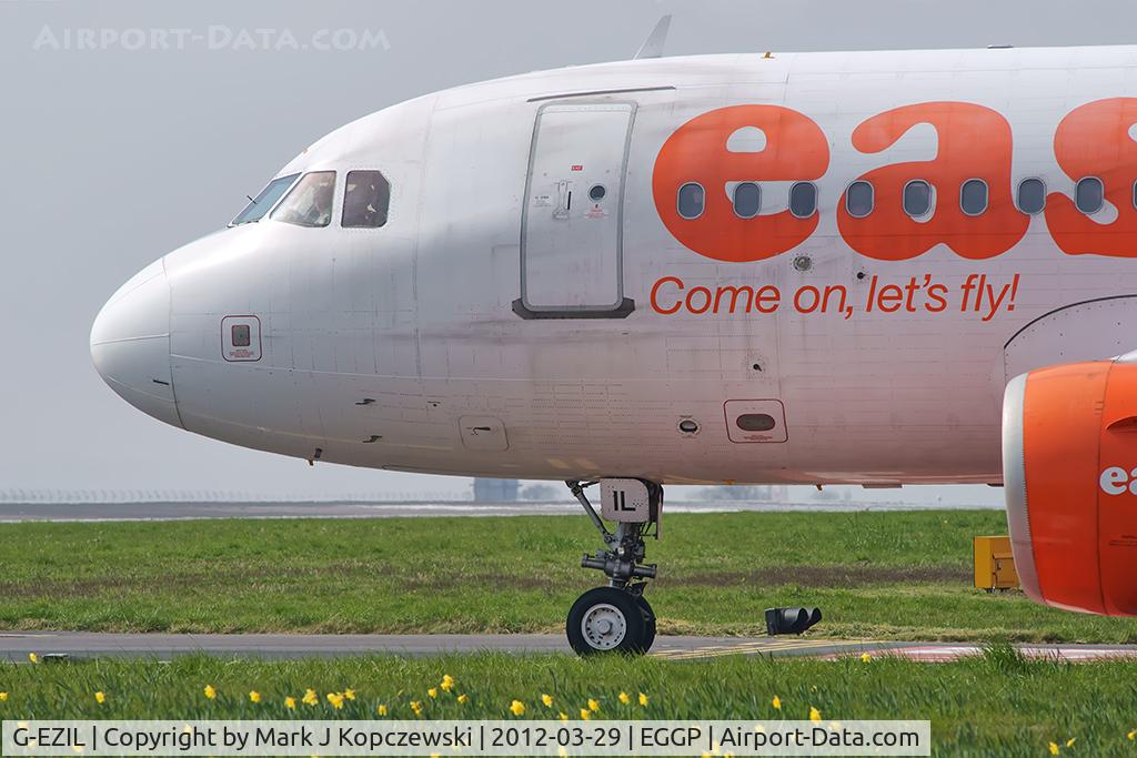 G-EZIL, 2005 Airbus A319-111 C/N 2492, At halt on taxiway A1 en-route to runway 27.