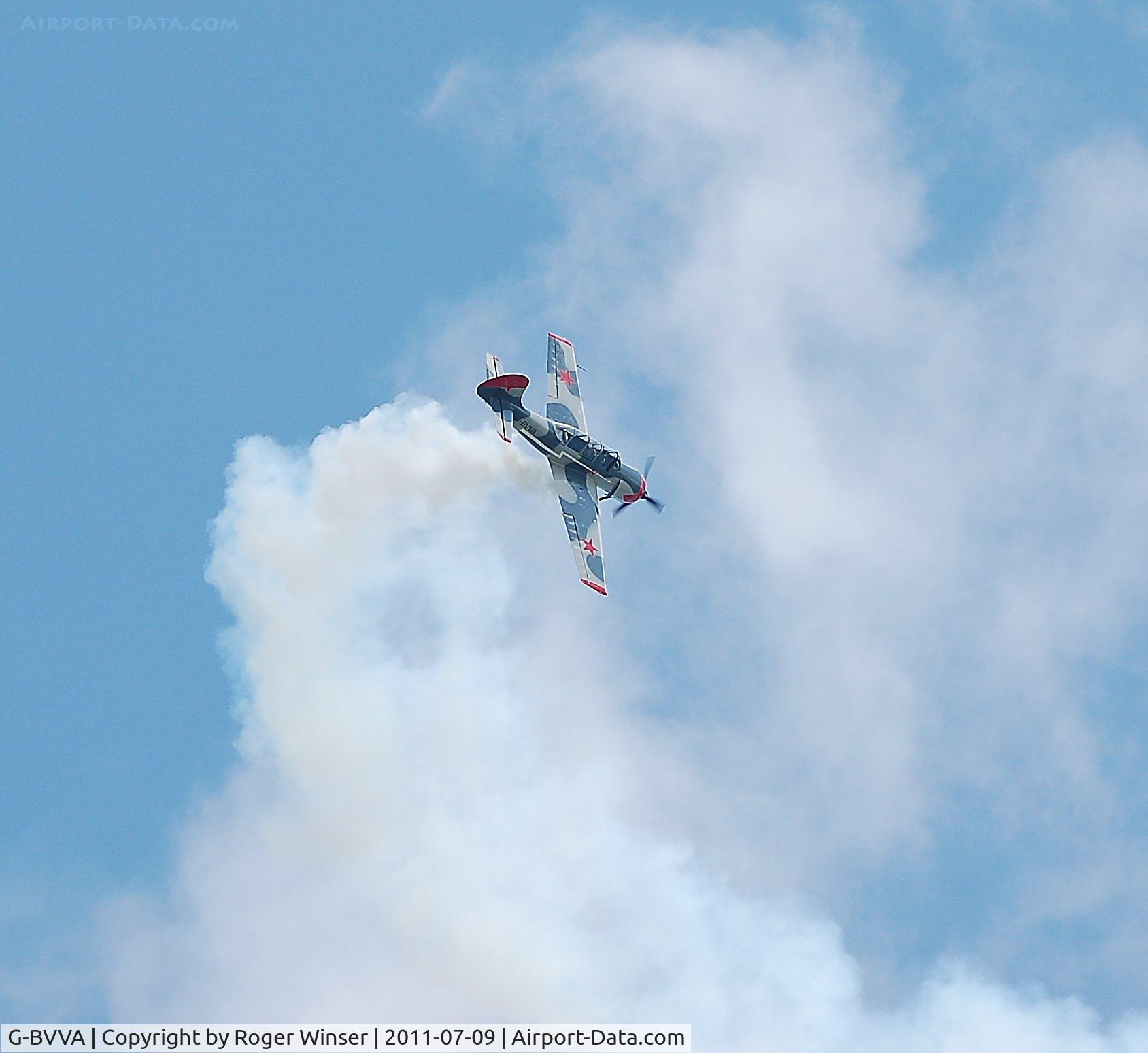 G-BVVA, 1987 Bacau Yak-52 C/N 877610, Off airport. Osprey 2 performing solo aerobatics at the Wales National Airshow, Swansea Bay, Wales, UK. Registered G-YAKE on 4th May 2012.
