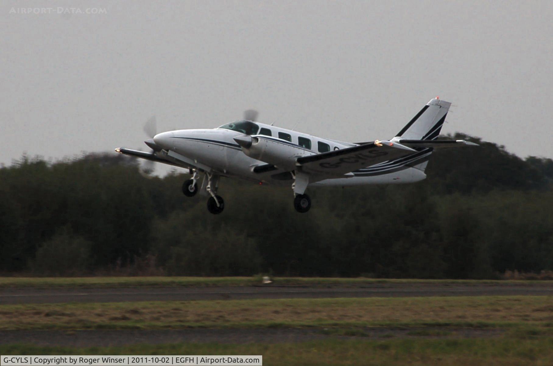 G-CYLS, 1982 Cessna T303 Crusader C/N T30300005, Oasis 303 Ltd's Crusader departing at dusk.