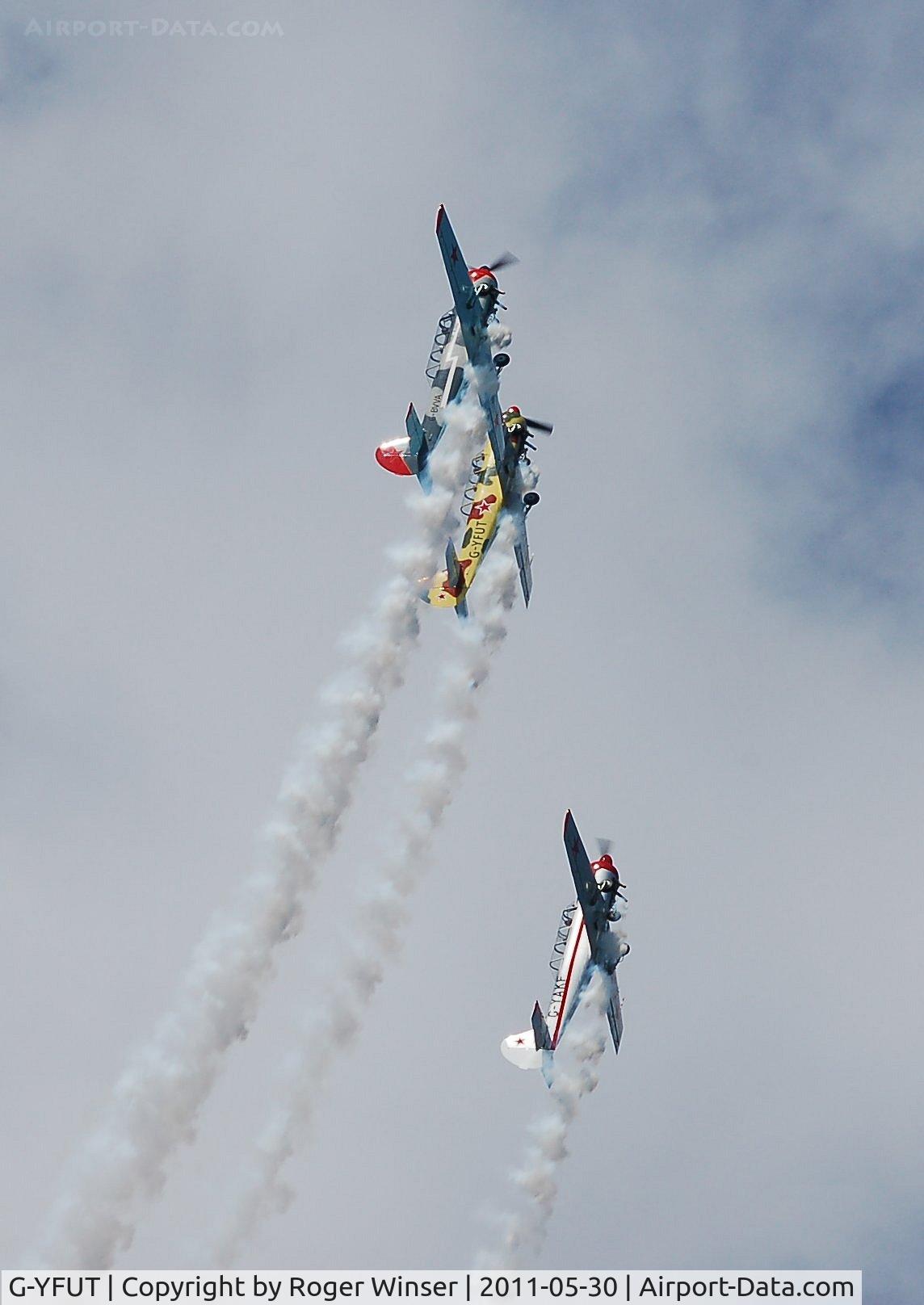 G-YFUT, 1988 Bacau Yak-52 C/N 888410, Off airport. Leading Team Osprey into a loop at the 2011 Mumbles Navy Days display, Swansea Bay, Wales, UK.
