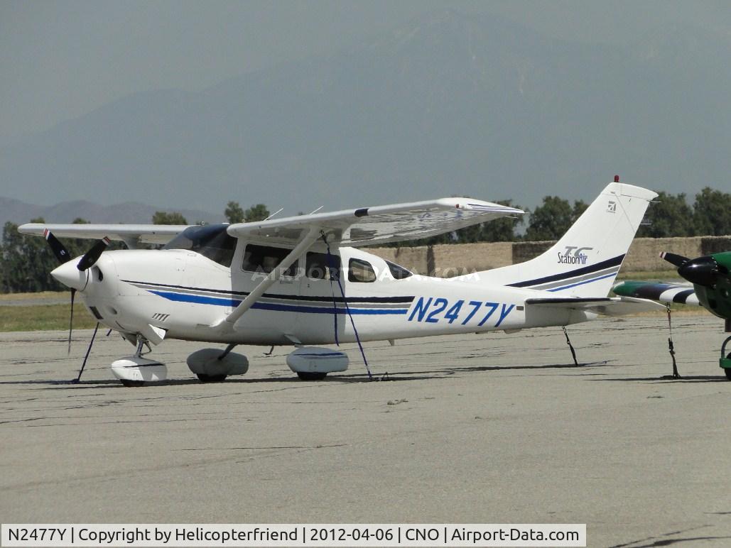 N2477Y, 2001 Cessna T206H Turbo Stationair C/N T20608294, Tied down and parked south of the tower