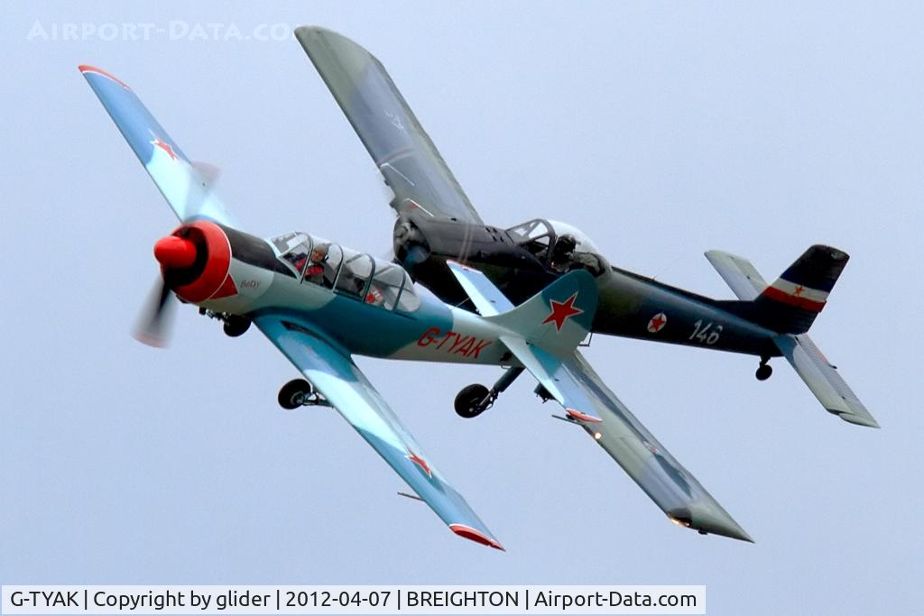 G-TYAK, 1989 Bacau Yak-52 C/N 899907, The Kraguj (G-BSXD) keeping close in the turn and the very gloomy conditions