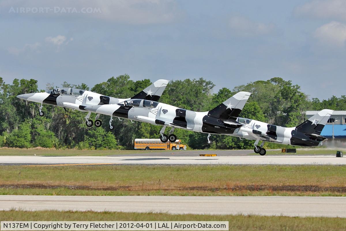 N137EM, 1980 Aero L-39 Albatros C/N PA031615, N137EM 1980 Aero Vodochody L39C, c/n: PA031615 and two colleagues form perfect symmetry at takeoff from 2012 Sun N Fun