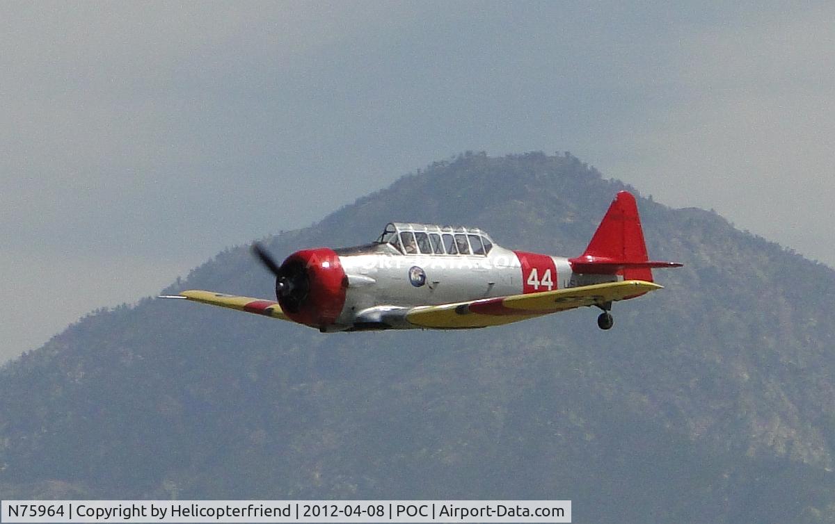 N75964, 1943 North American SNJ-4 Texan C/N 88-9830, Over the outer fence, coming in low