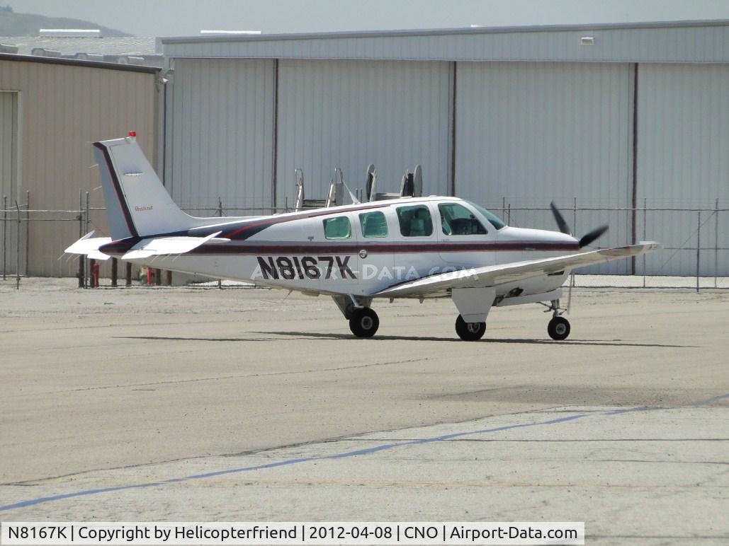 N8167K, 1993 Beech B36TC Turbo Bonanza C/N EA-547, Taxiing towards the fuel pump area, passing Yank's backyard