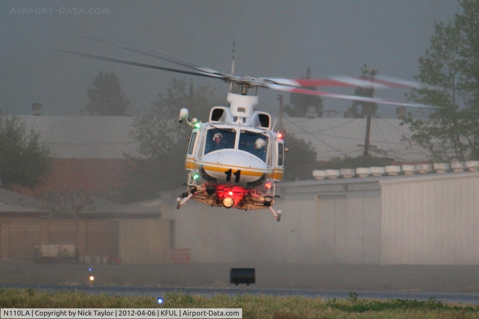 N110LA, 2005 Bell 412EP C/N 36392, Stirring up some dirt while departing