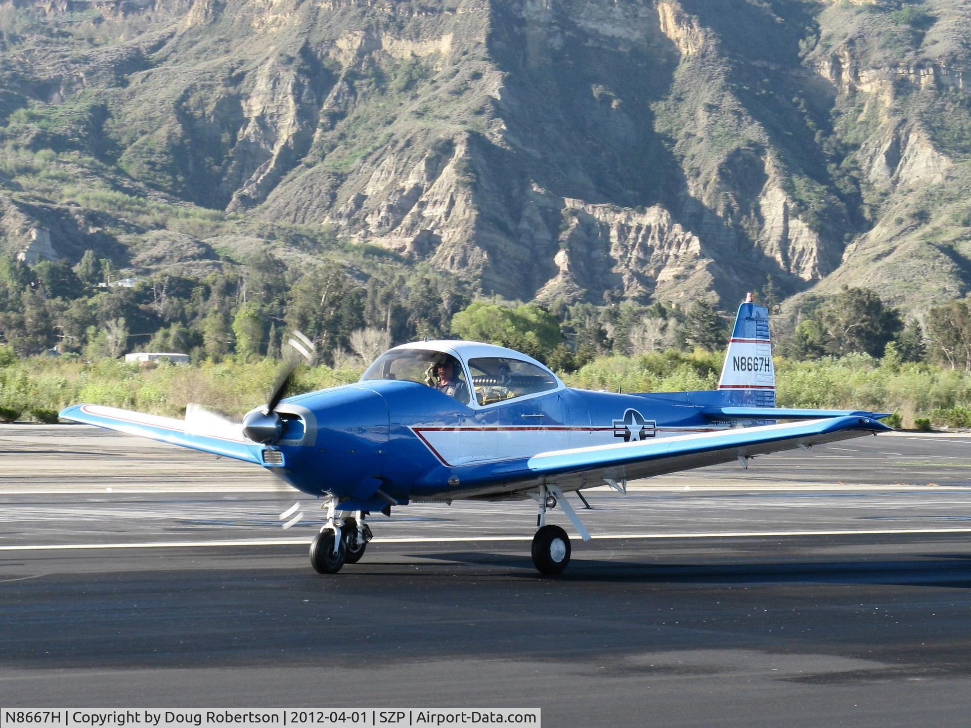 N8667H, 1947 North American Navion C/N NAV-4-667, 1947 North American NAVION, Continental IO-520 285 Hp upgrade, Young Eagles warm-up flight taxi off Rwy 04. This NAVION always test flies before giving YE Flights.