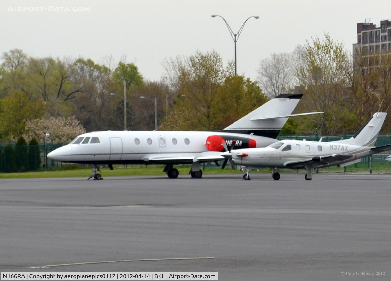 N166RA, 1981 Dassault Fan Jet Falcon (20F) C/N 449, N166RA seen on a rainy and cloudy day in Cleveland, Ohio.
