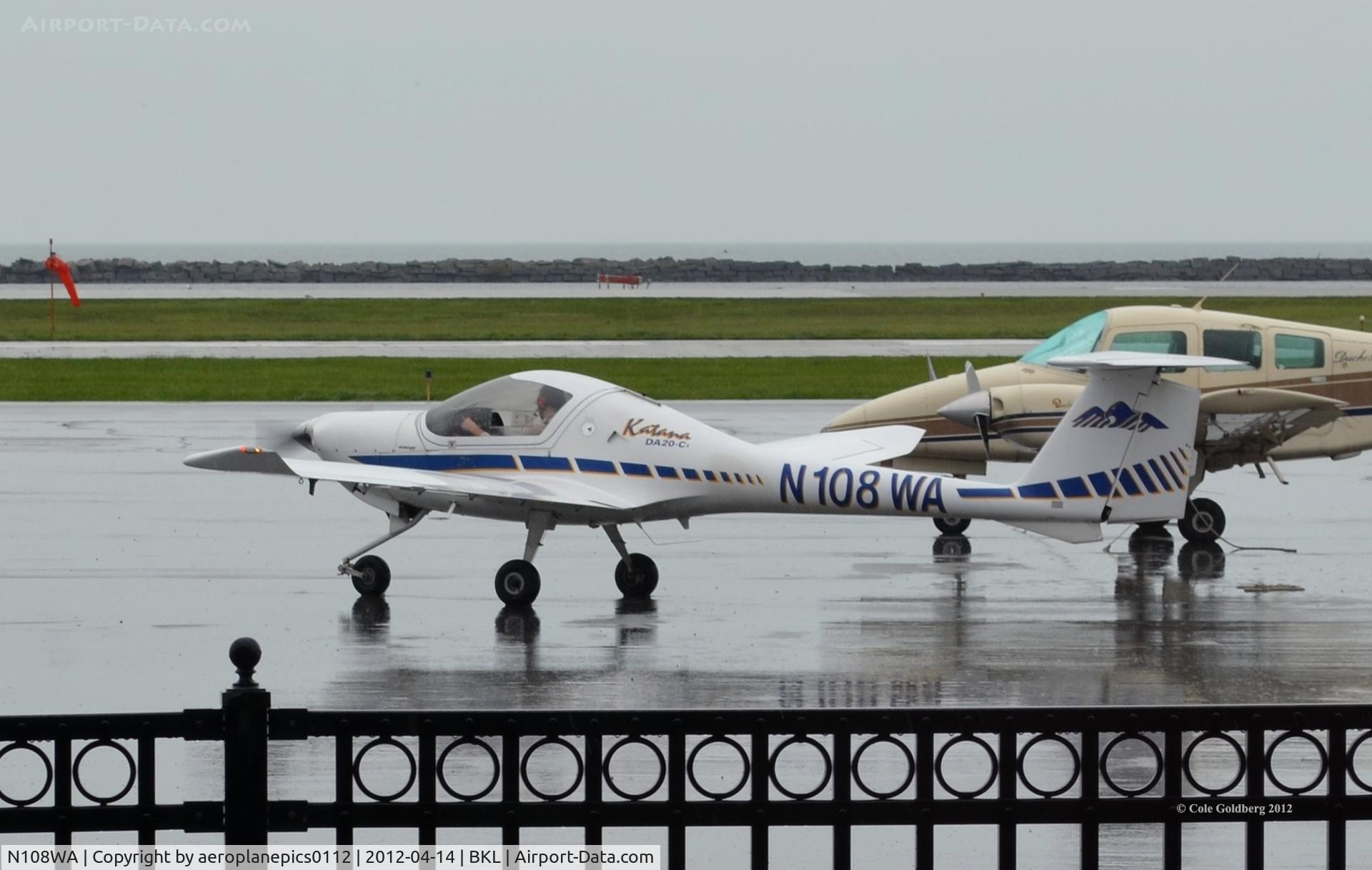 N108WA, 2000 Diamond DA-20C-1 Eclipse C/N C0098, N108WA seen taxiing for takeoff on a rainy day in Cleveland.