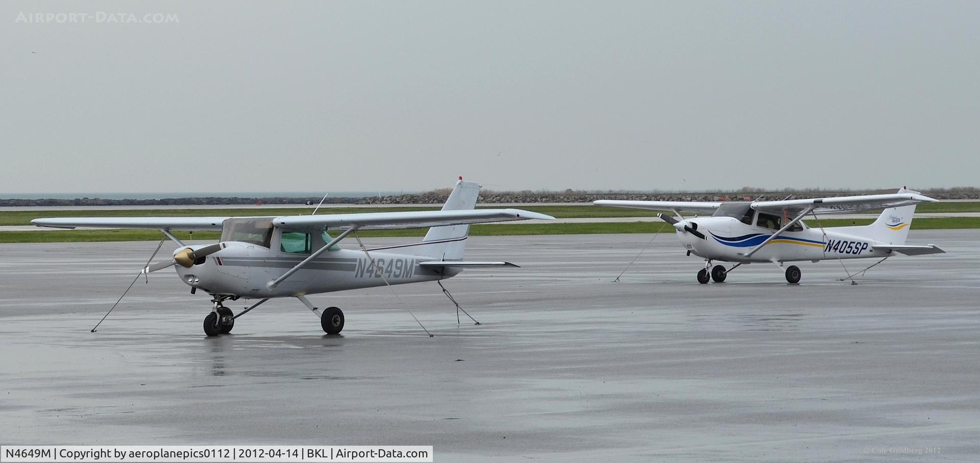 N4649M, 1980 Cessna 152 C/N 15284474, N4649M and N405SP seen on a rainy day at KBKL.