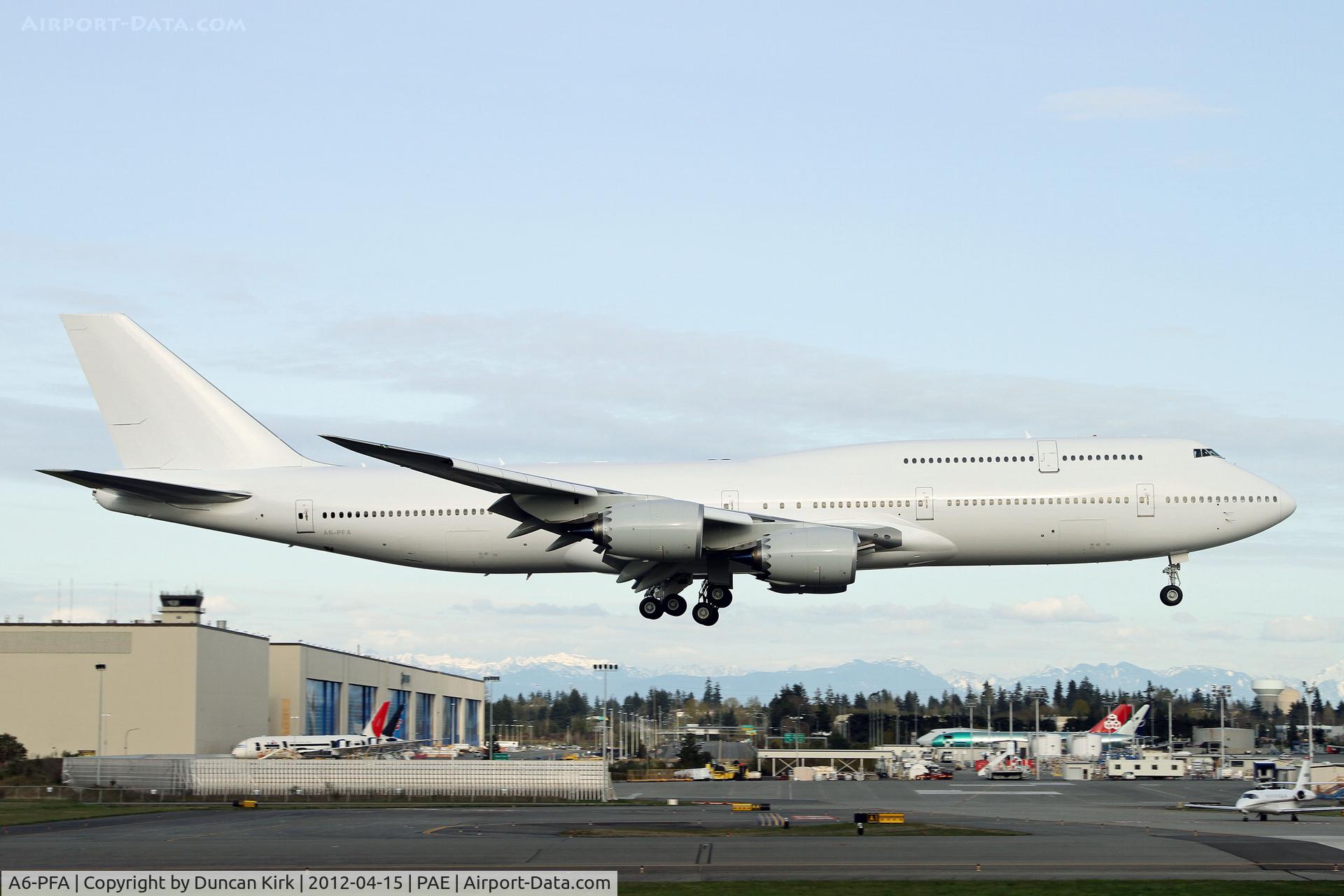 A6-PFA, 2011 Boeing 747-8Z5 C/N 37500, Typical. A bank of cloud ruins this test flight landing shot!
