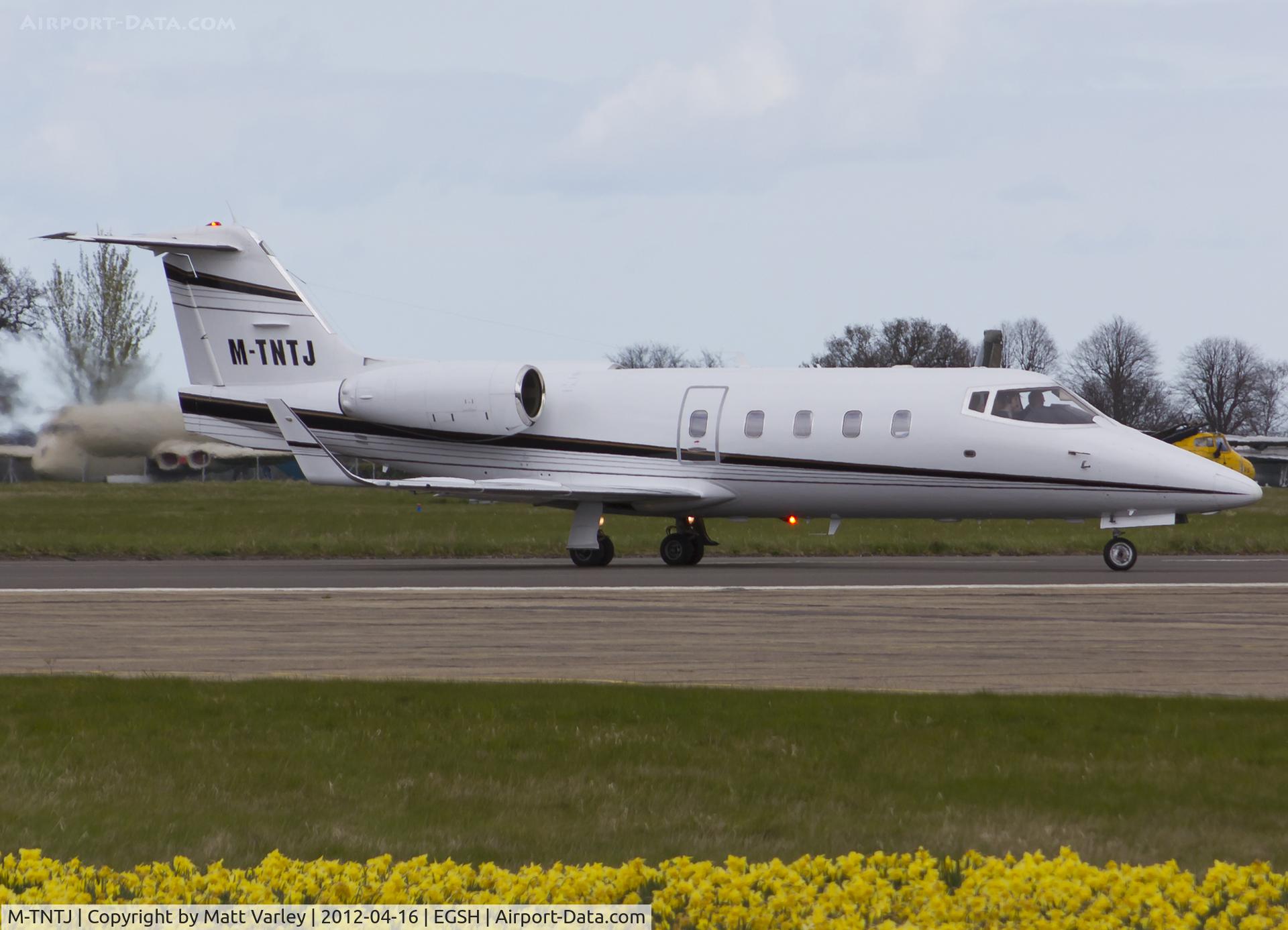 M-TNTJ, 1983 Learjet 55 C/N 55-087, Departing EGSH after ferrying the crew of OO-TAZ.(ZE708)