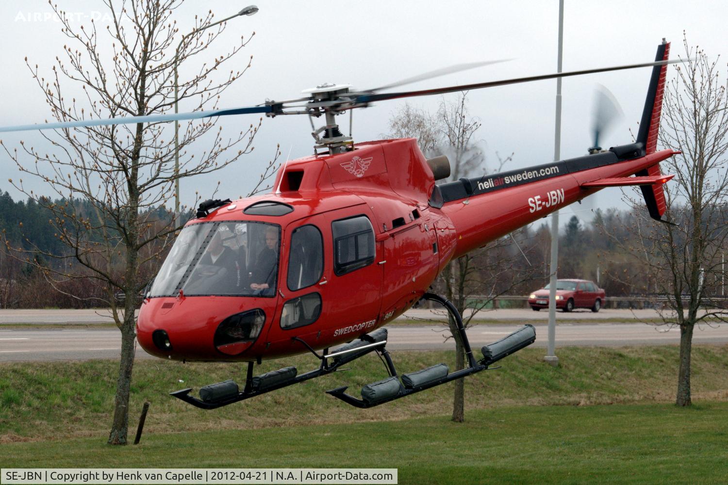 SE-JBN, 1983 Eurocopter AS-350B Ecureuil Ecureuil C/N 1684, AS 350B helicopter taking off from a field next to the Brokindleden in Linköping, Sweden.