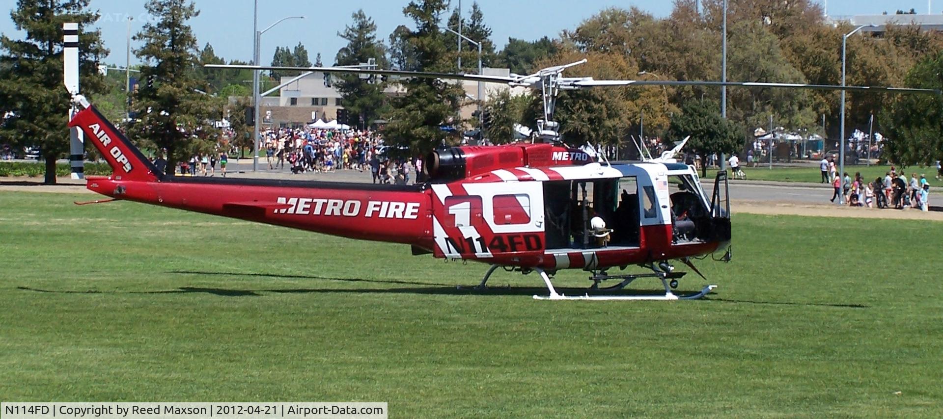 N114FD, Bell UH-1H Iroquois C/N 13257 (72-21558), At Picnic Day, UC Davis, after horse lift demonstration.
