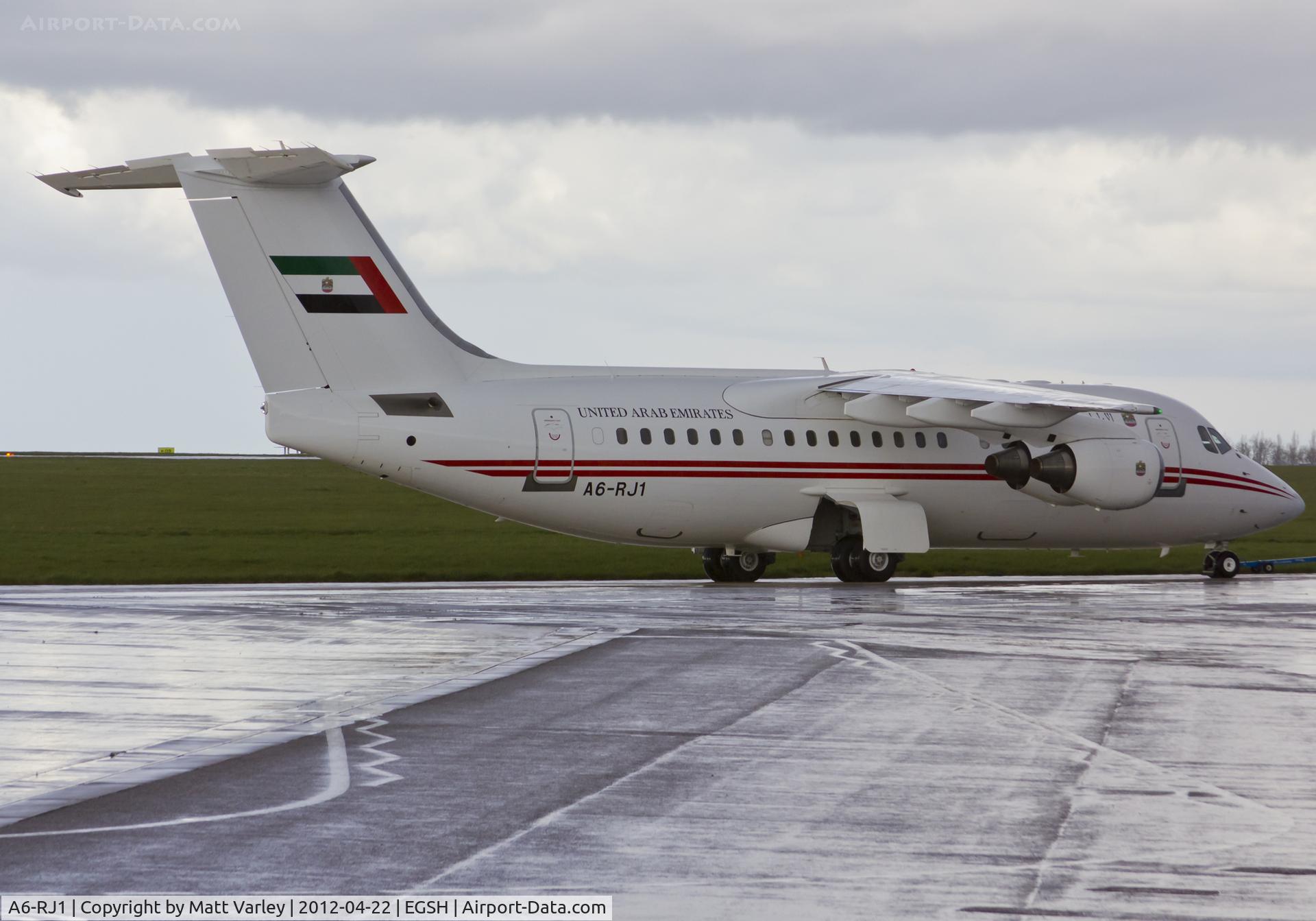 A6-RJ1, 1998 British Aerospace Avro 146-RJ85A C/N E2323, Being towed to KLM Engineering.