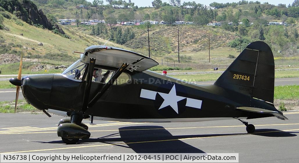 N36738, 1941 Stinson 10A C/N 8138, Awaiting clearance to cross active runways to park in transient parking for display