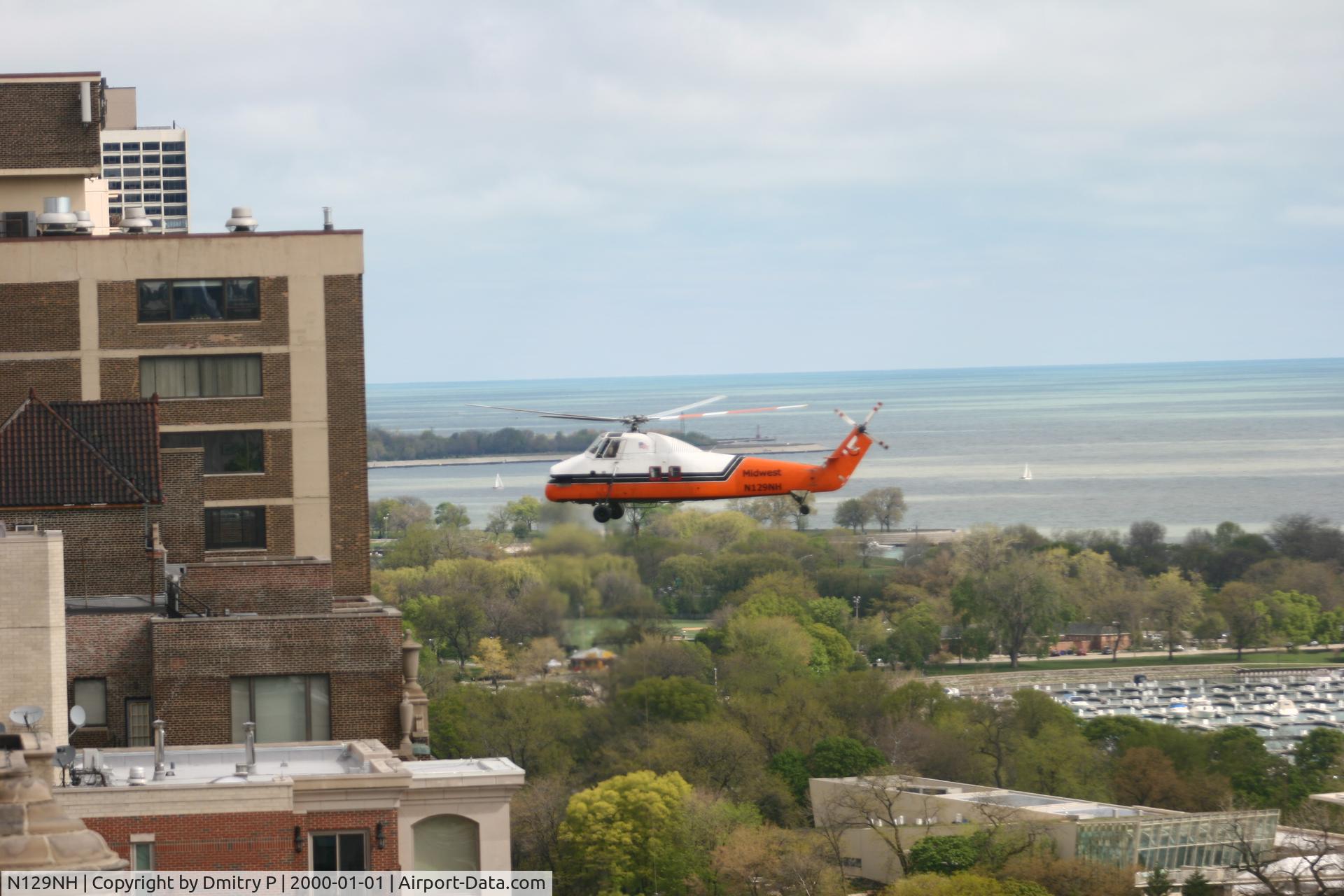 N129NH, 1975 Sikorsky S-58JT C/N 58-855, This helicopter is moving giant A/C units from rooftop to rooftop, looking very precarious!