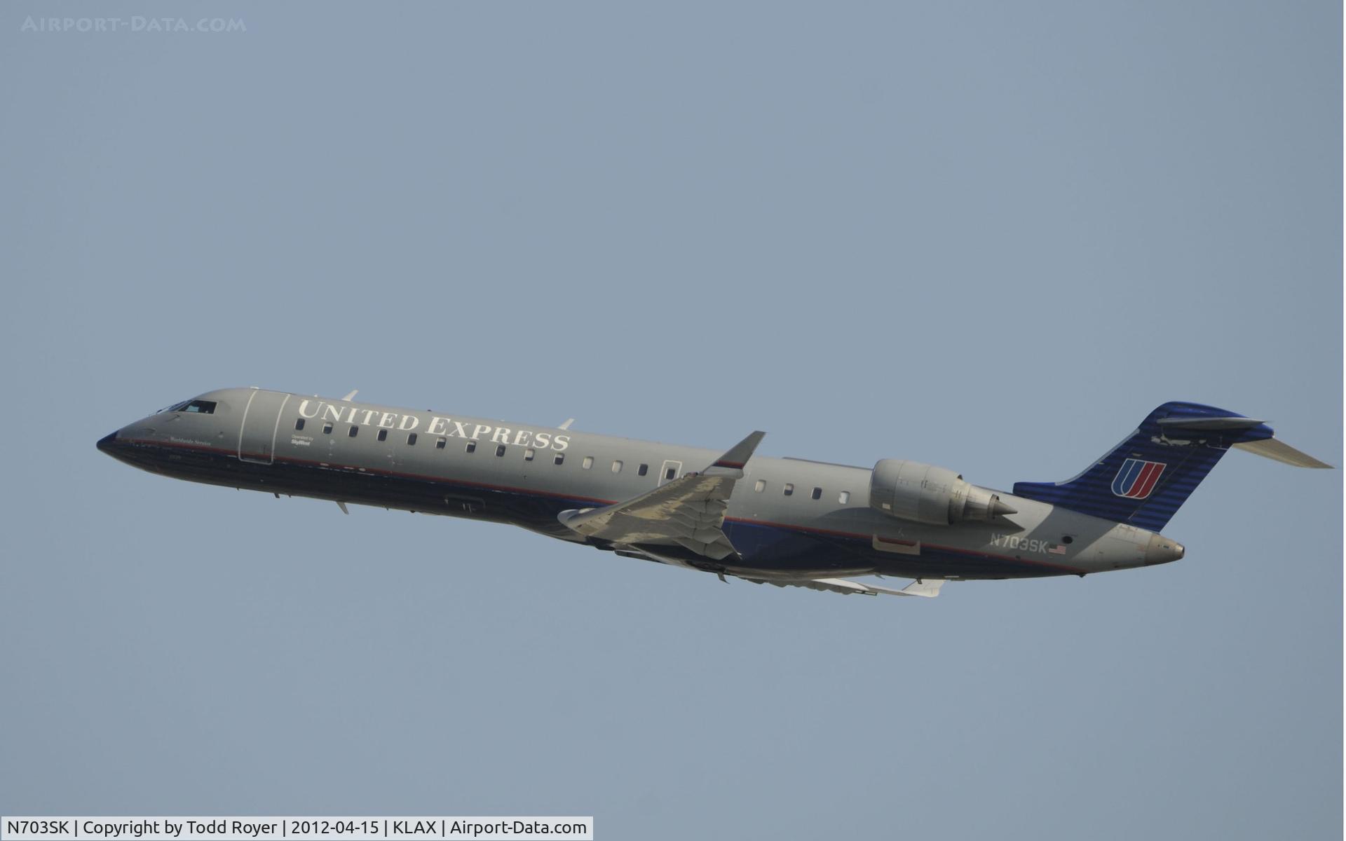 N703SK, 2004 Bombardier CRJ-701ER (CL-600-2C10) Regional Jet C/N 10139, Departing LAX on 25R