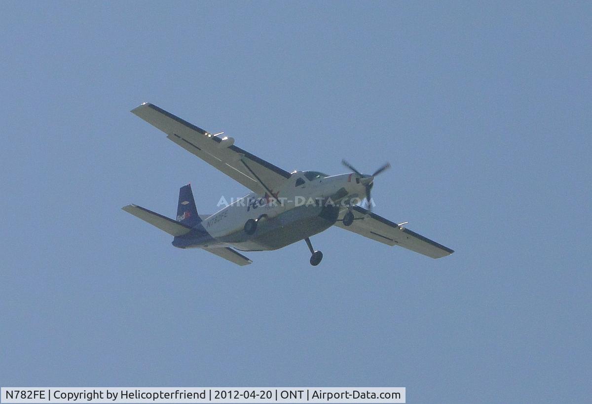 N782FE, 1991 Cessna 208B Super Cargomaster C/N 208B0280, Coming out of the haze and turning down wind for runway 26