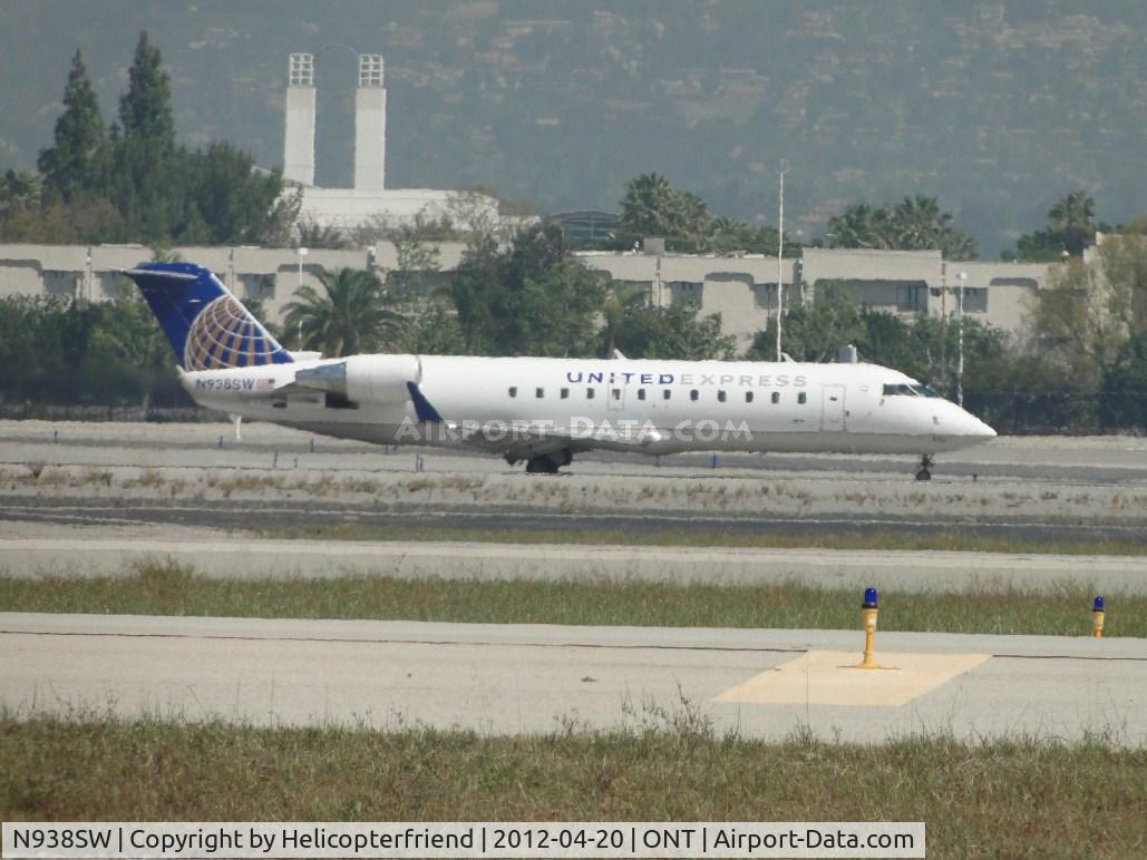 N938SW, 2003 Bombardier CRJ-200LR (CL-600-2B19) C/N 7741, Taxiing back on taxiway November after landing on 26R